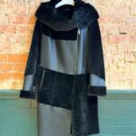Front view of black genuine sheepskin three-quarter coat with plush collar